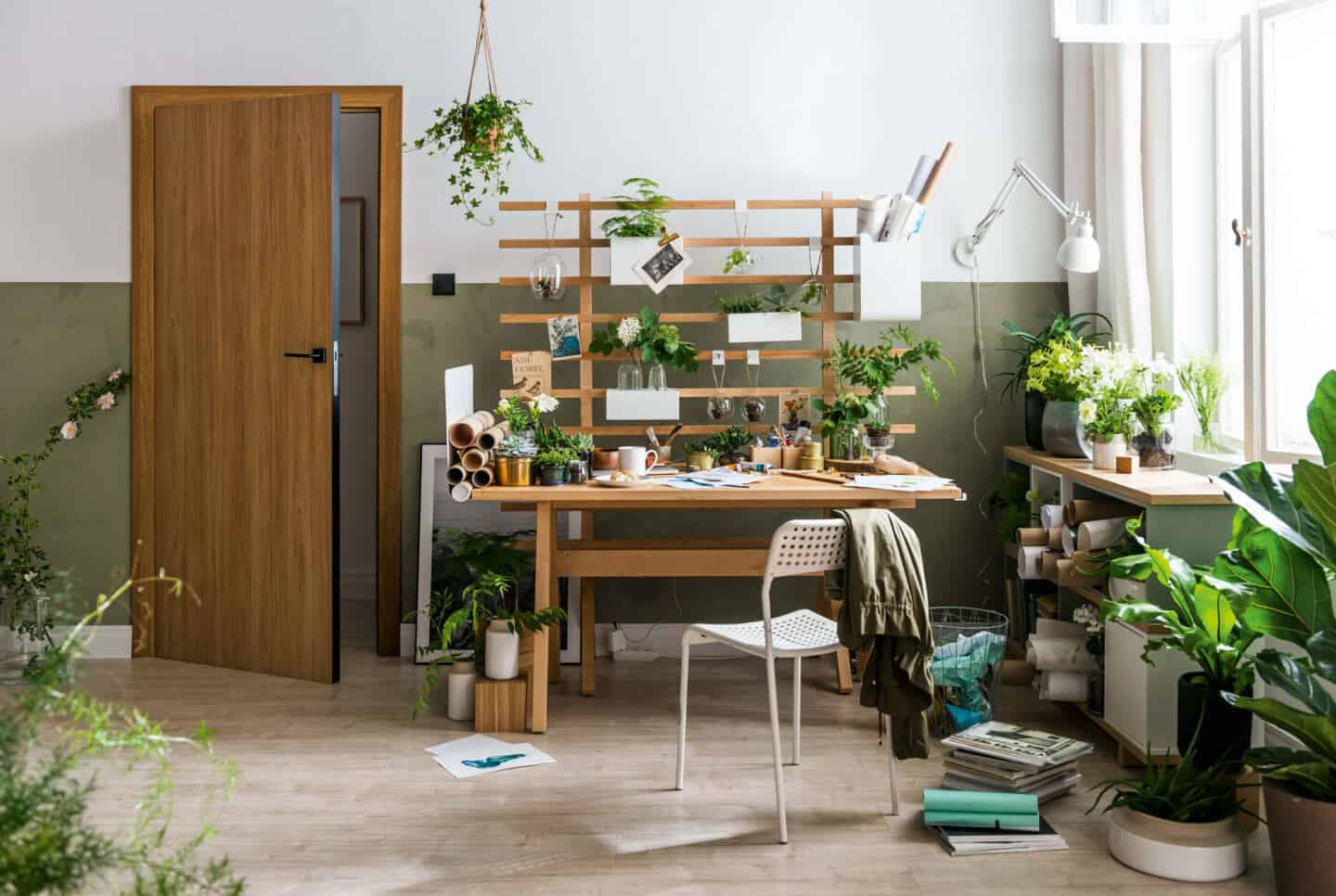 productive home office with wooden desk and green walls