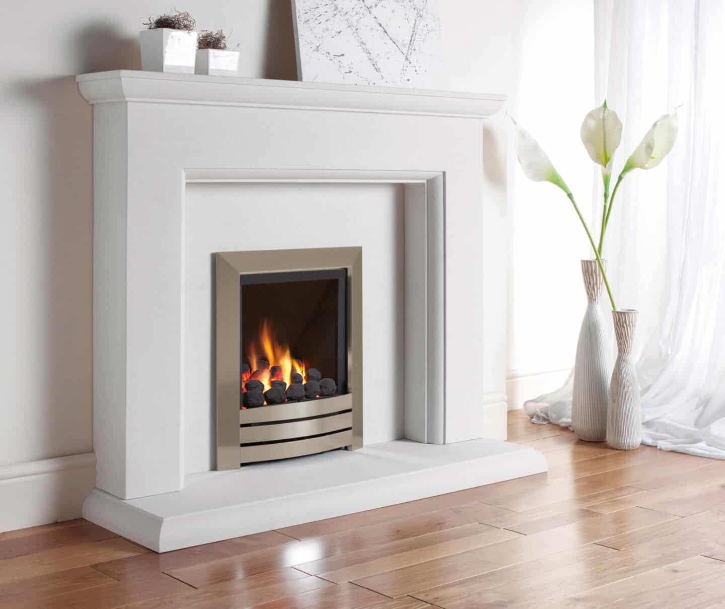 Gas heater in white fire surround