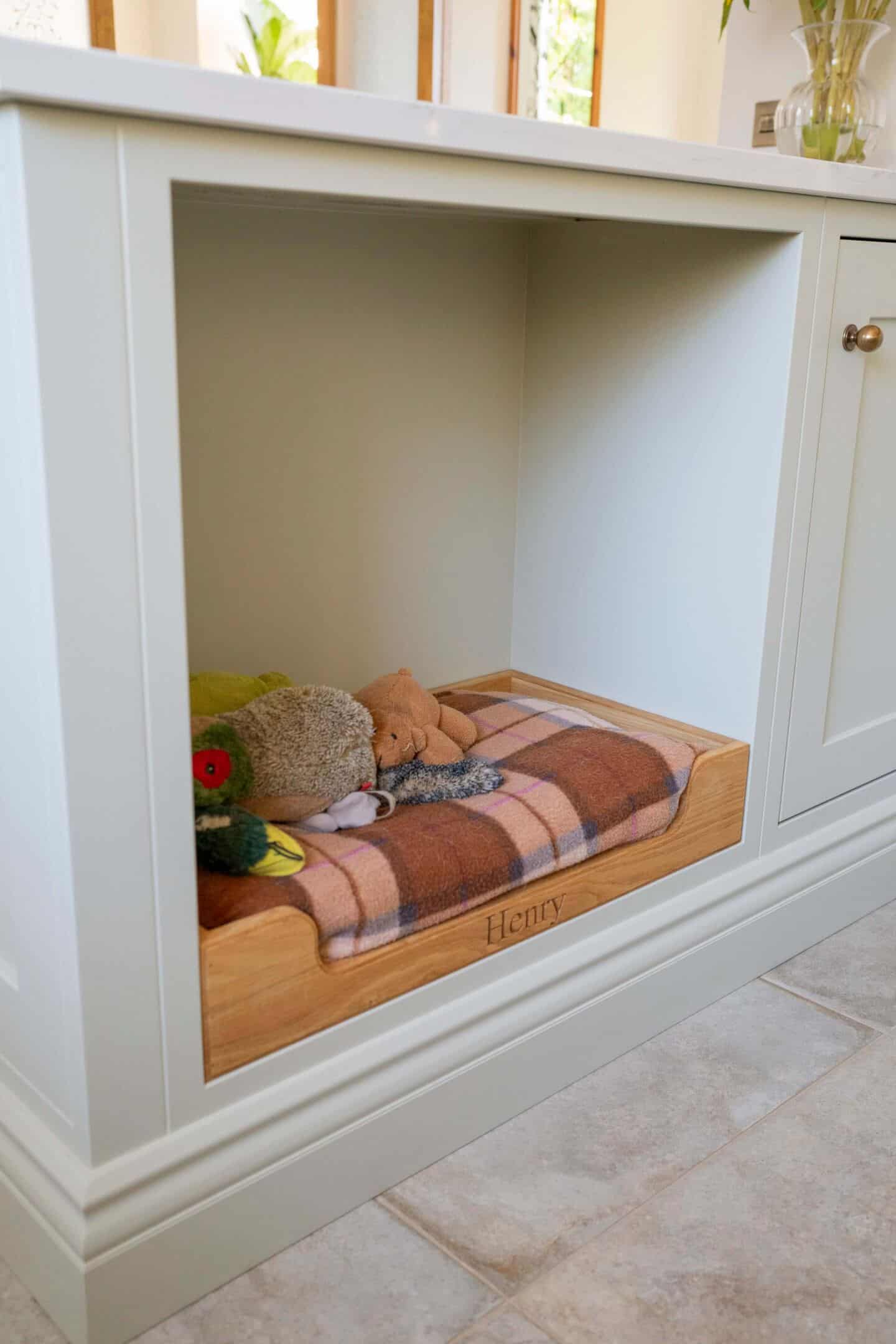 A bespoke handcrafted kitchen with integrated dog bed.