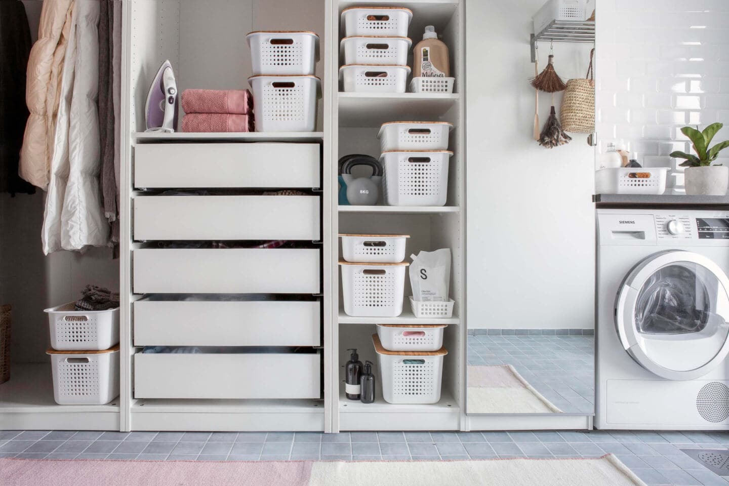 Freestanding utility room cabinetry with plastic storage boxes