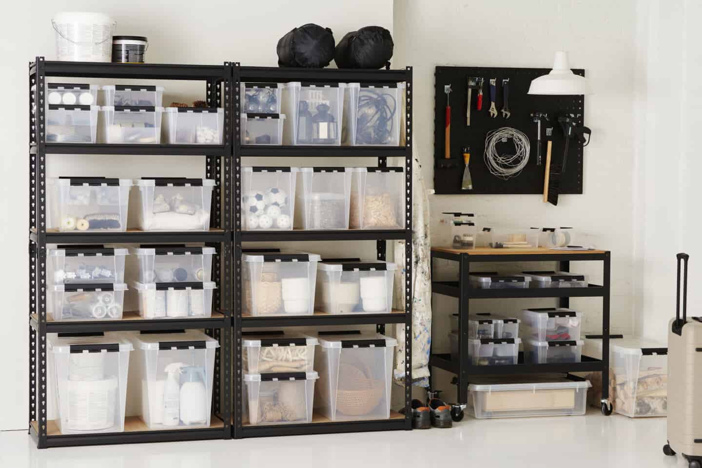 Shelving in the garage full of storage boxes to create more usable space at home