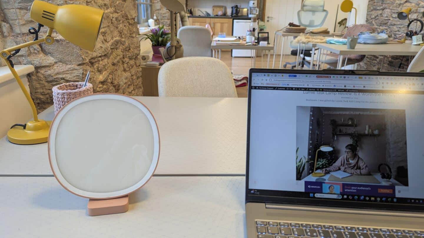 Lumie Dash Sad Lamp on a desk next to an open laptop in a coworking space for women in Totnes
