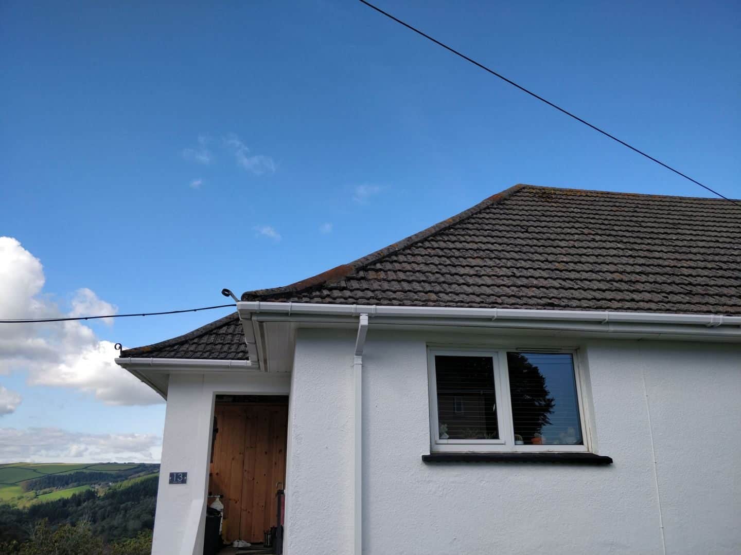 A white house with a tiled roof