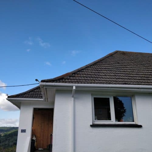 A white house with a tiled roof