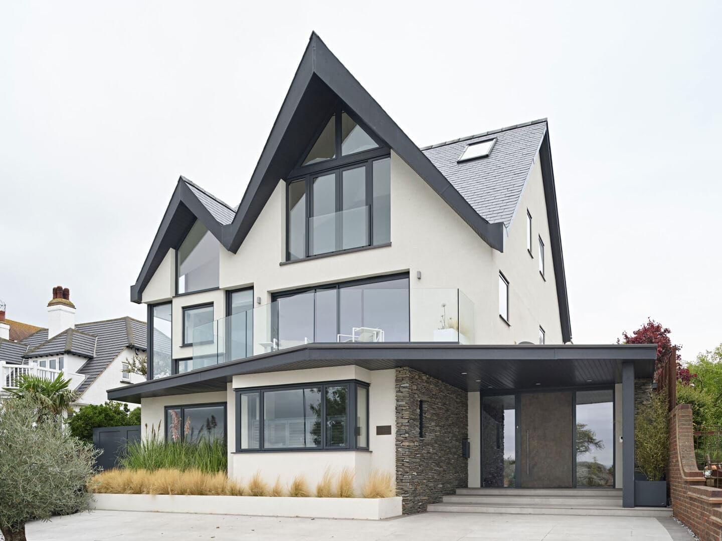 A detached house with covered entryway and pitched roof